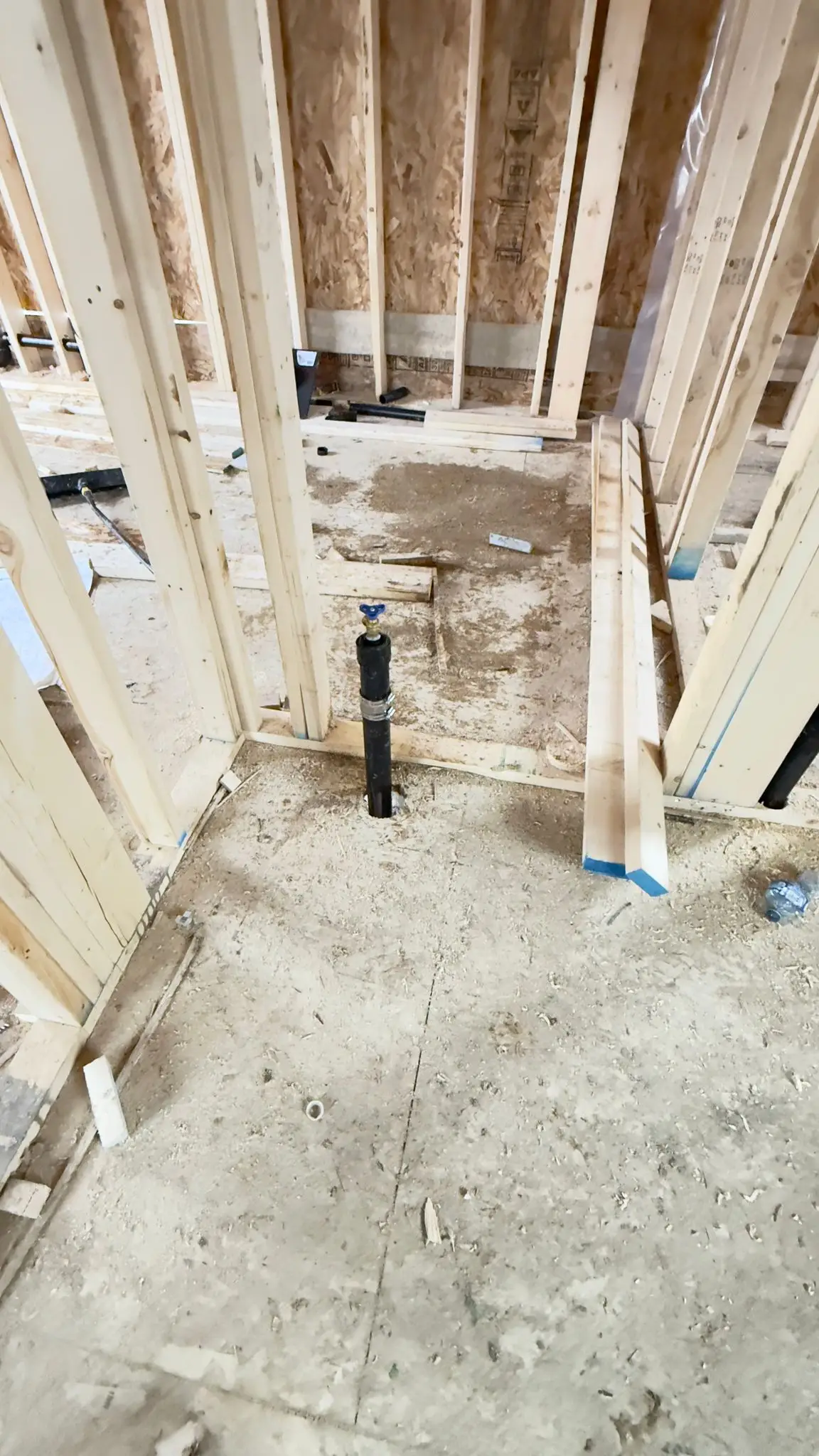 Drainage stub-ups left standing proud of the subfloor for the fixtures above.