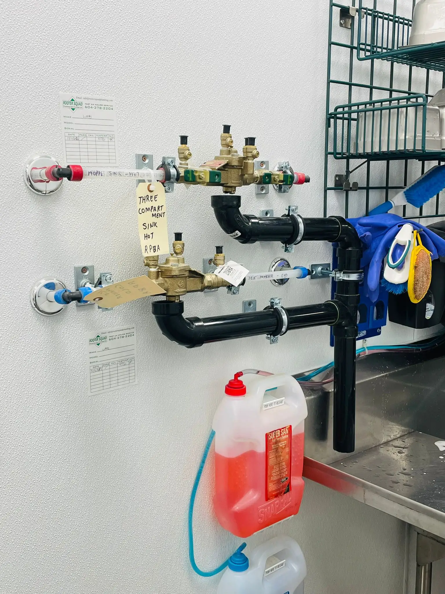 A backflow prevention assembly and isolation valves in a restaurant back of house.